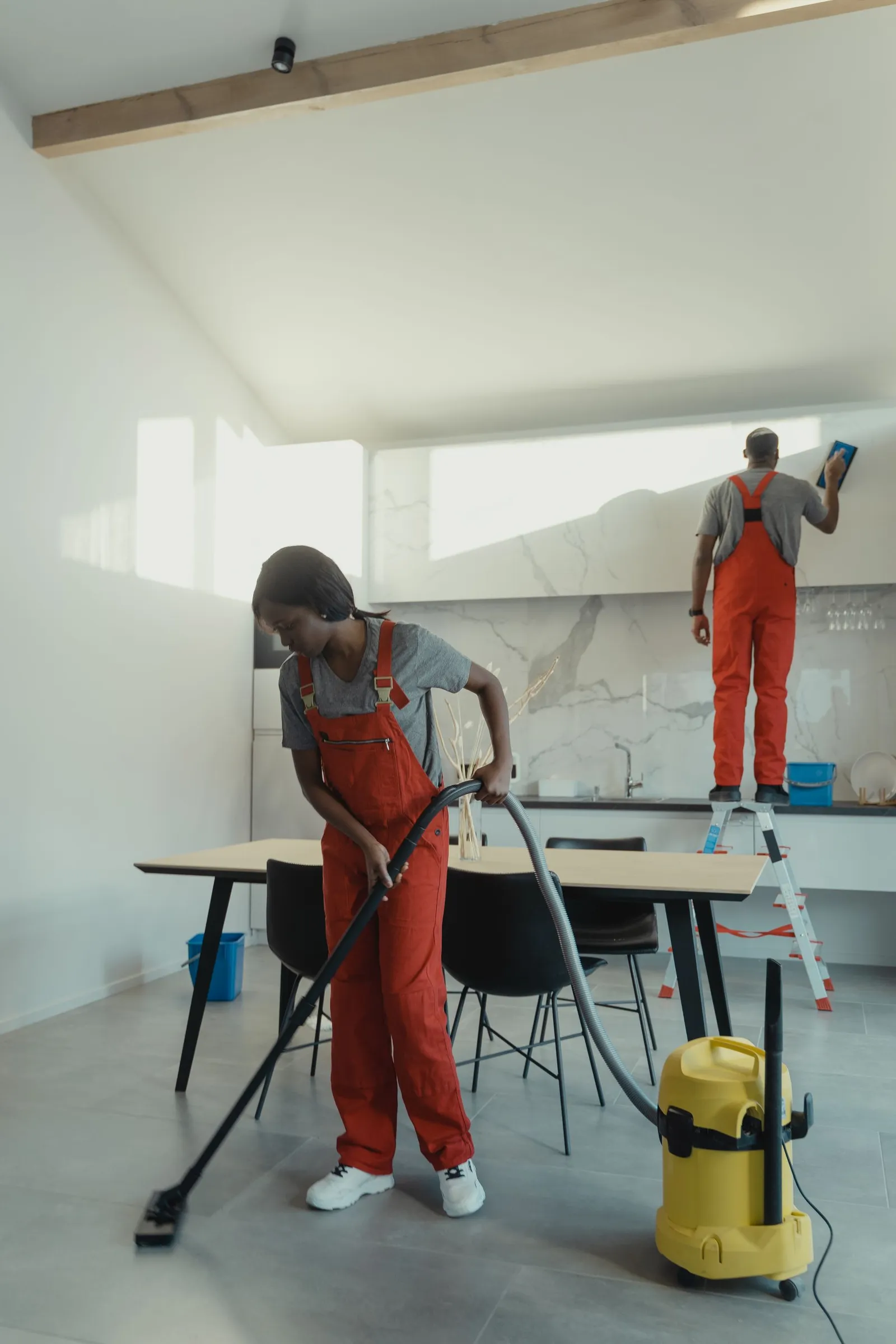Stock photograph of a cleaning team caring for an interior